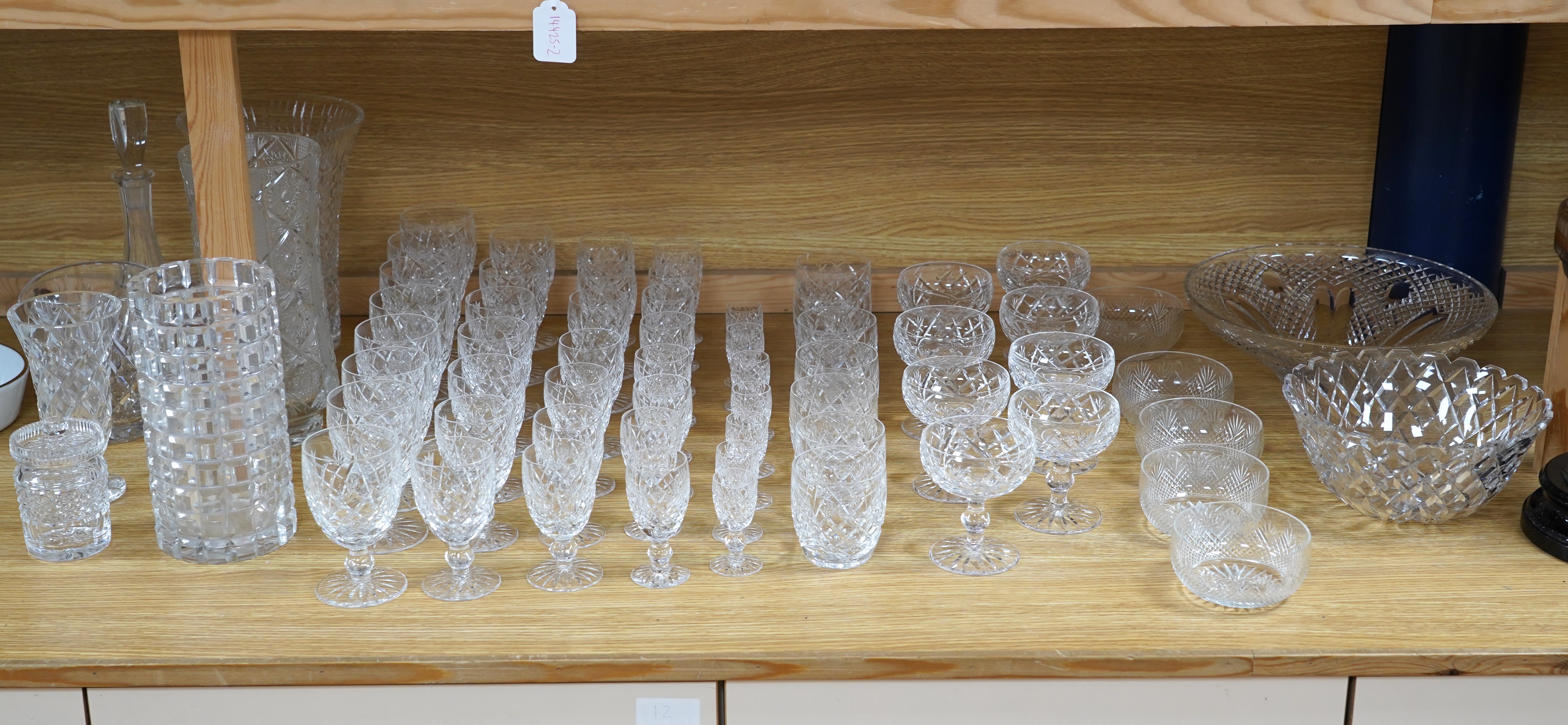 A suite of Waterford drinking glasses in various sizes, including wine glasses, liqueur glasses, champagne glasses, etc. together with glass vases and jugs, etc. (66)